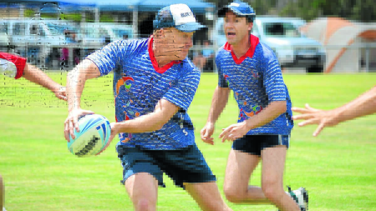 TURN BACK THE CLOCK: Darren Skinner and Nathan Henwood in action during the Coolah Veterans Touch Carnival. A record 37 teams will play at the annual tournament this weekend. Photo: BEN HARRIS	 031113bhcoolah1060