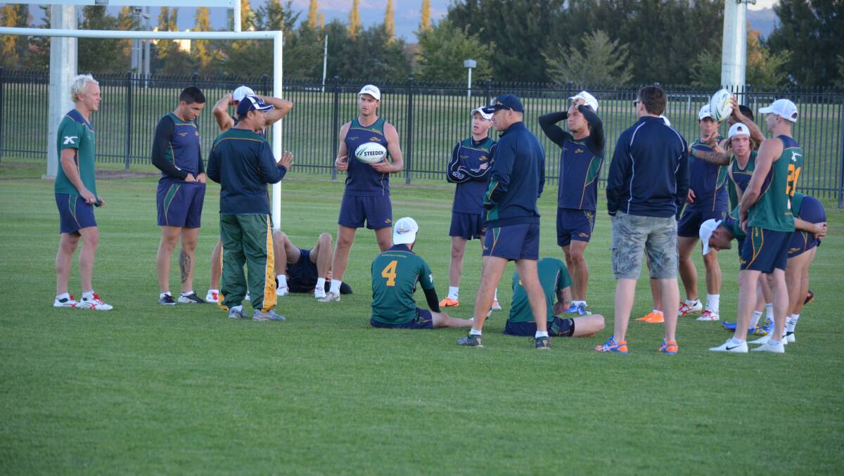 Australia men's open coach Tony Trad lays down his instructions to his players. Photo: BEN HARRIS