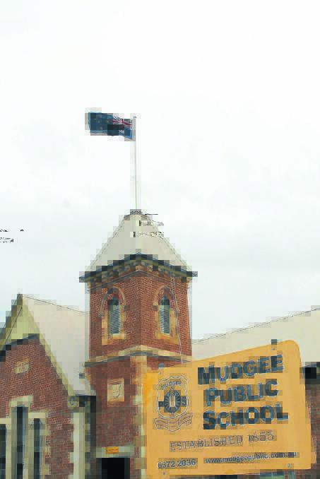 FLYING THE FLAG: Mudgee Public School has reinstalled a flagpole over their administration building after a 64-year absence. 191214\sp MPS flag\IMG_8256