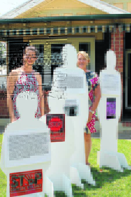 Much of the work of Mudgee's Barnardos involves what White Ribbon Day is about. Pictured with the “silent witnesses” that will be a part of the local display on Wednesday are Tianna Lasham and Kate Baker.