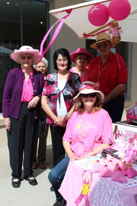Pauline Bassingthwaite, Dawn Staples, Lyn Nasmith, Yvonne Benson, Alison Hughes and Arnold Benson at a past Pink Ribbon stall in Mudgee. 