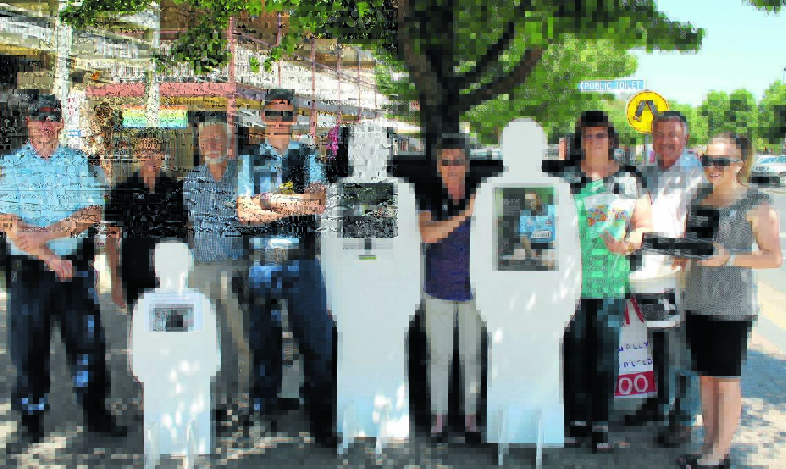 The local White Ribbon Day display on Wednesday was held by volunteers mainly from the Mudgee People Against Violence Committee. Pictured (from left) Senior Constable Daniel Moss, Renee Lamshed (Carewest), Jim Sheedy (TAFE), Constable Dan Fielding, Marisa Quintana (Mid-Western Regional Council), Maira Babbage and Andrew Radclyffe (Benevolent Society), and Nicole Morris (Barnardos). 