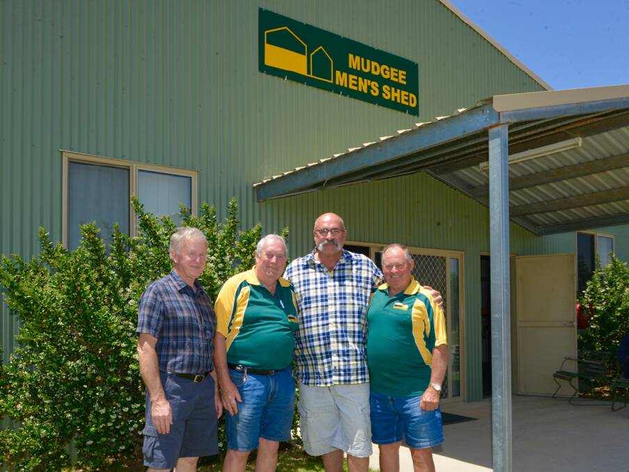 Merv Hughes returned to the Mudgee Men’s Shed once again to officially re-open the facility nearly 12 months after it was gutted by fire. He is pictured with the Shed’s treasurer Col Brierty, secretary Sam Cutting, and manager Neil Giggins. Pictured right is some of the clean up in December 2014.