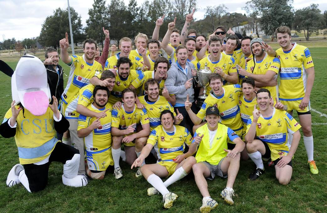 JUBILANT: The CSU Yellow Mungoes team were all smiles after winning the Centennial Coal Cup grand final against Blackheath Blackcats on Saturday. Photo: CHRIS SEABROOK 083014csugf15a