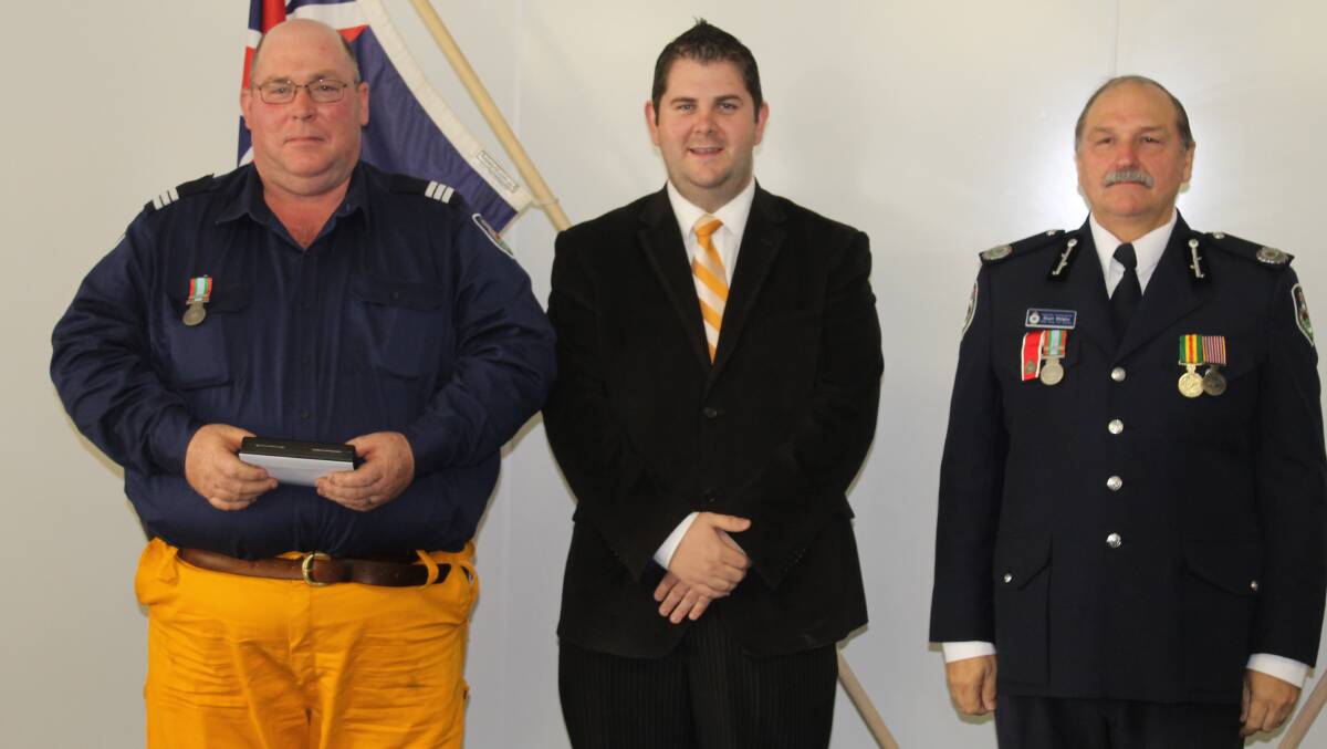 Barry Stait received the long service medal and 1st clasp for 28 years service as a member of the Cooyal and  Mudgee HQ brigades, he is pictured with Mid-Western Regional Council Deputy Mayor Cr Paul Cavalier and NSW RFS Assistant Commissioner Stuart Midgley.