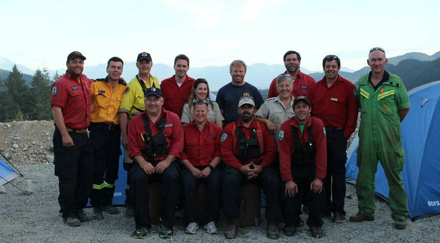 Mudgee National Parks and Wildlife Service ranger Michael Sharp (back, third from left) pictured with the incident management team for the Wood Lake fire in Canada, where he was divisional supervisor.