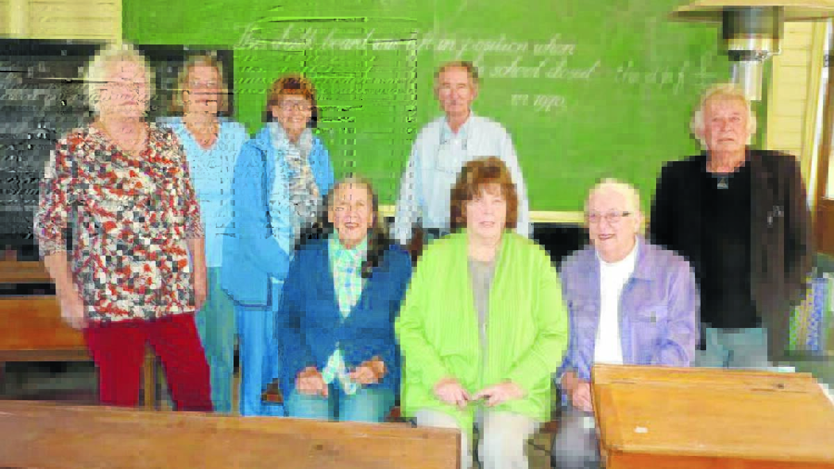 Member of Mudgee Valley Writers at the Eurunderee School, where they celebrated the group’s 29th anniversary.  From left are Pamela Meredith, Joy Hibberd, Ann Milligan, Miriam Bates, Kevin Pye, Jill Baggett, Joan Taylor, Bob Campbell.