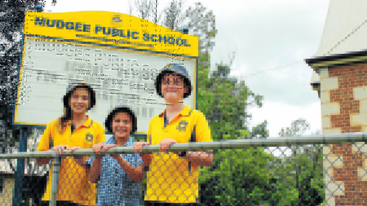 Mudgee Public School students Isabella Shearman, Kate Suttor, and Aidan Hargraves, were among the thousands who returned to school on Wednesday.
