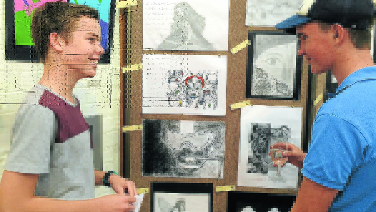 Ethan Reinhard and Josh Payne check out the artwork at 2015’s Youth Week exhibition.