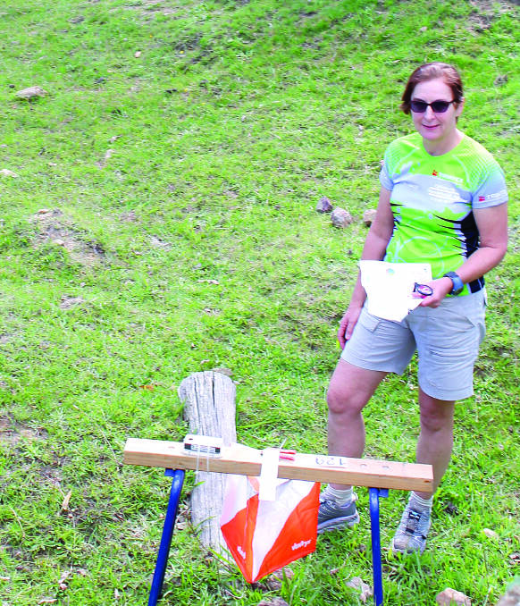 SETTING A COURSE: Course setter for Day 1 Hilary Wood at one of the controls for the Easter Orienteering Carnival in Clandulla.