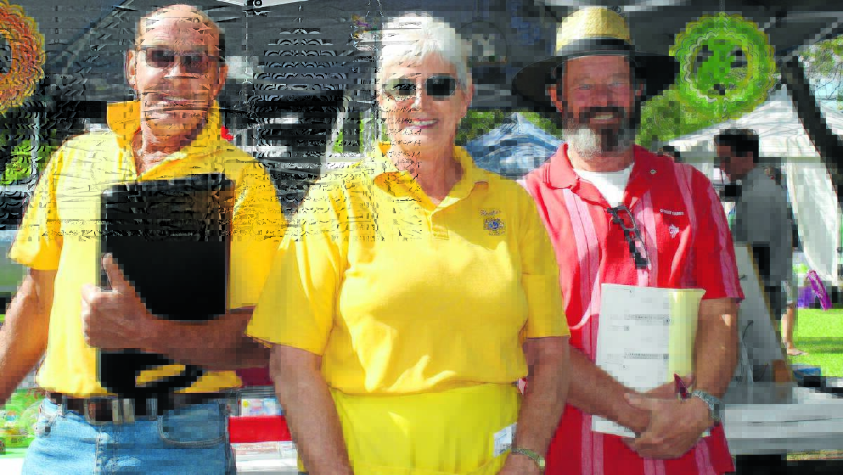Lions Geoff and Heather Priester, pictured with Guy Kemp, made sure the Lawson Park markets were running smoothly.