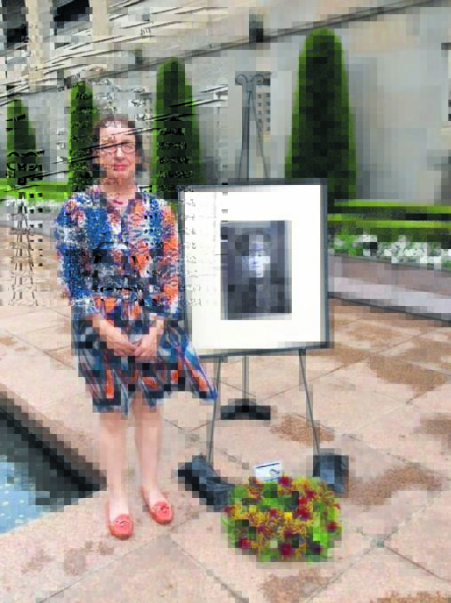 Cecilia  Hannon, with a photograph of her great-uncle, John Tucker, at the Australian War Memorial where his Last Post Ceremony took place in January.