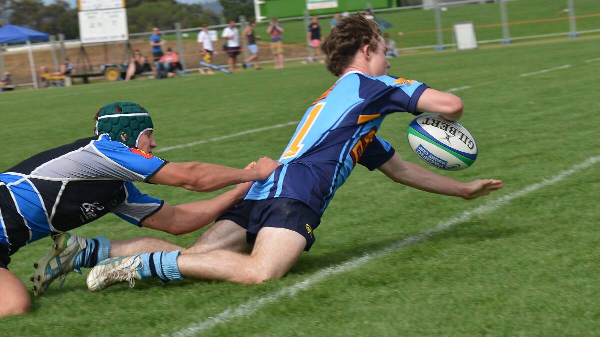 Central West colts' Tom Fisher scores  against Far North Coast on Saturday.