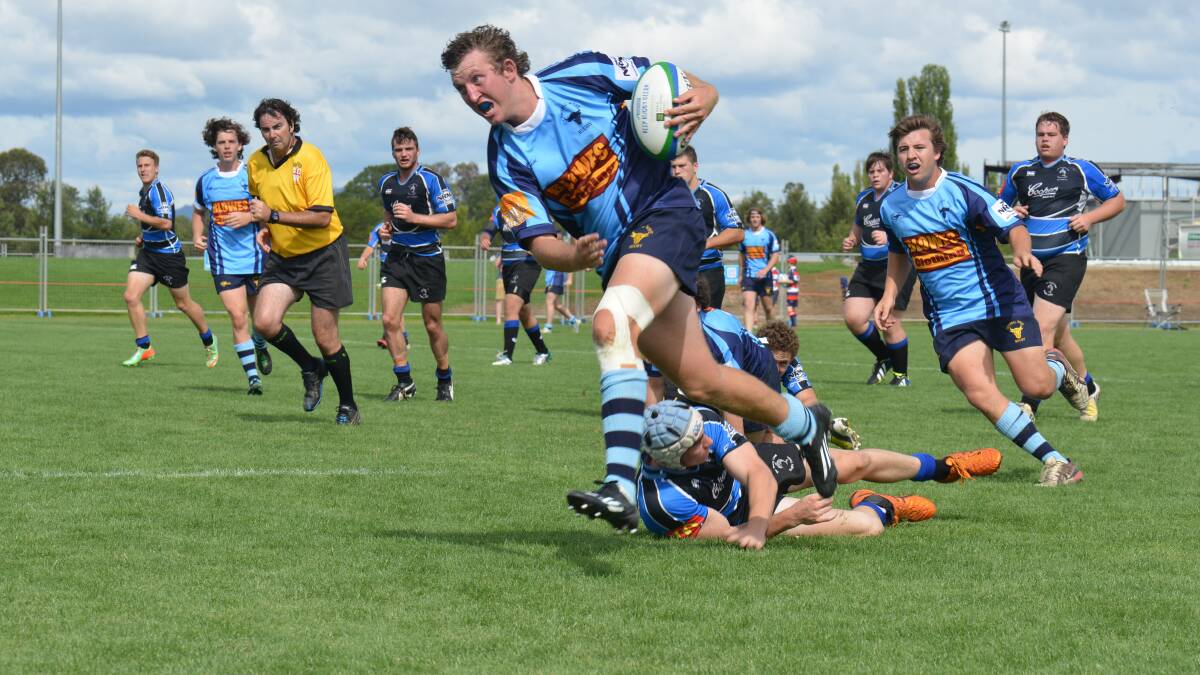 Central West colts' Ben Wright busts through the Far North Coast defence.
