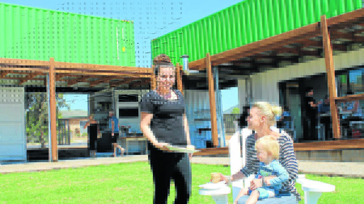 Hannah Clayton serves Jasmine Williams and Artie Keightley at the recently opened High Cube Café in Mudgee.