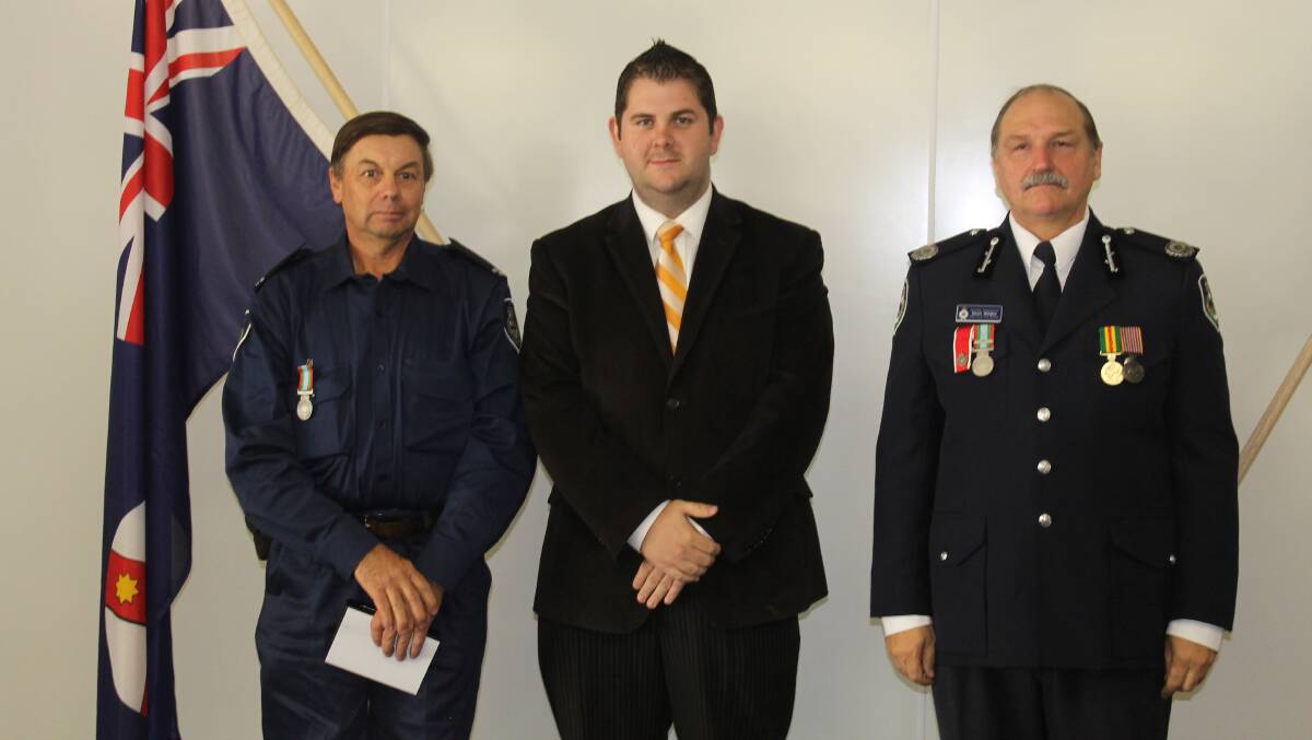 Garry Dollisson received the long service medal for 10 years service, he is pictured with Mid-Western Regional Council Deputy Mayor Cr Paul Cavalier and NSW RFS Assistant Commissioner Stuart Midgley.