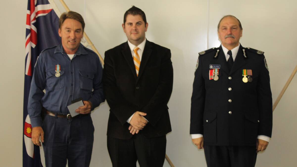 William Burns received the long service medal for 17 years service as a member of the Ulan, Ulan/Merriwa, and Lawson Brigades, he is pictured with Mid-Western Regional Council Deputy Mayor Cr Paul Cavalier and NSW RFS Assistant Commissioner Stuart Midgley.