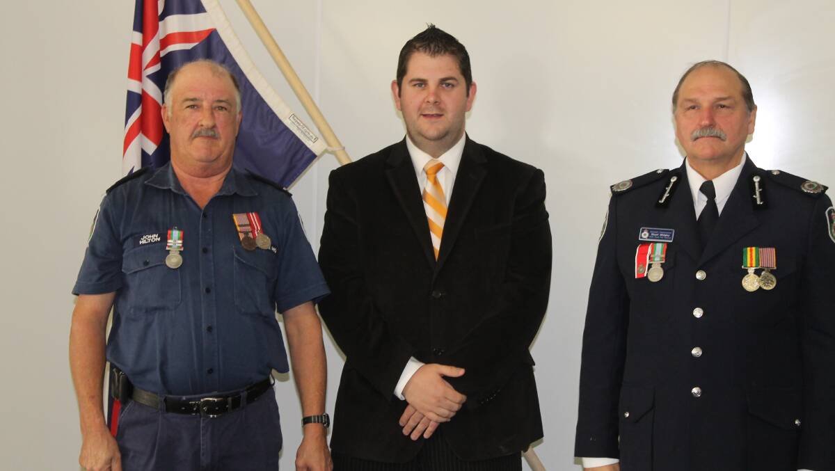 John Hilton received the long service medal and 1st clasp for over 34 years combined service to the Gulgong and Mudgee brigades, he is pictured with Mid-Western Regional Council Deputy Mayor Cr Paul Cavalier and NSW RFS Assistant Commissioner Stuart Midgley.
