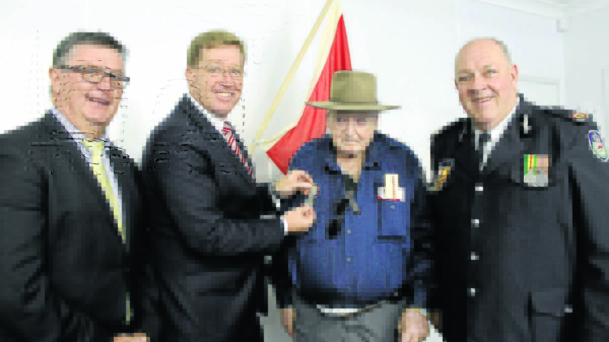 Founding member of the Clandulla Bushfire Brigade, Albert Parlett was recognised for 70 years service at the Cudgegong RFS District long service presentation on Saturday. He is presented with his medal by Mid-Western Regional Council Mayor Des Kennedy, Deputy Premier Troy Grant, and NSW RFS Assistant Commissioner Bruce McDonald.
