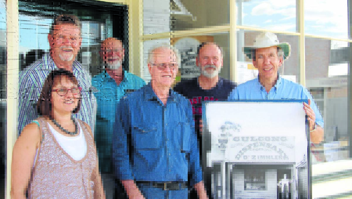 Holtermann Museum Steering Committee members Maureen Hall, Bruce McGregor, Bill Larner, Maurice Gaudry, David Warner and Chris Pearson with one of the iconic images recently gifted by The State Library of NSW.