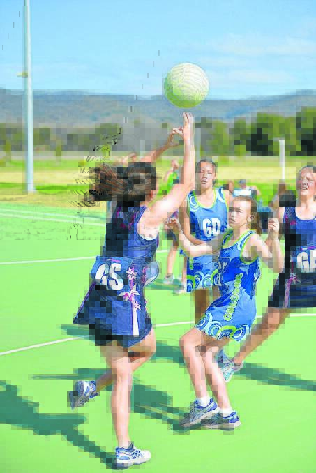 Gulgong Sonics goalkeeper Tayla Pennell defends against Starlet attacker, Ally Henry.