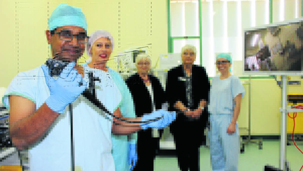 Urologist Dr Bala Indrajit with the flexible cystoscope alongside Nursing Unit Manager of Theatre at Mudgee Hospital Trish Kempton, Mudgee Hospital Auxiliary members Jan Bransgrove and Marian Cowell with Urology Registrar Sam Fitzpatrick. 