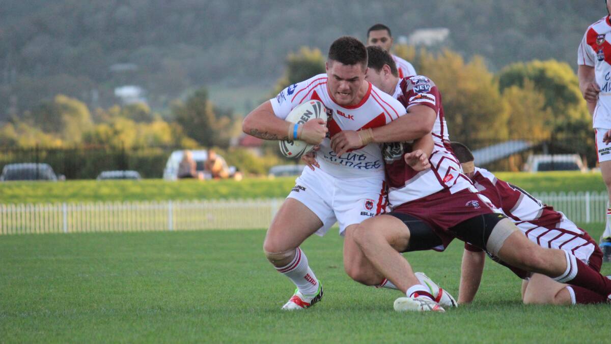 Andrew Warwicker is tackled by Blayney in the premier division match at Glen Willow Regional Sporting Complex on Saturday. PHOTO: DARREN SNYDER