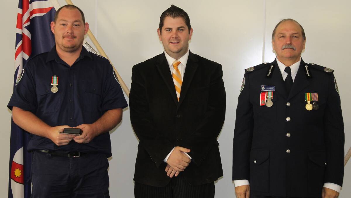 Andrew Mottershead of the Mudgee HQ Brigade, (formerly Wollar and Hawkesbury HQ) received the long service medal for 11 years service, he is pictured with Mid-Western Regional Council Deputy Mayor Cr Paul Cavalier and NSW RFS Assistant Commissioner Stuart Midgley.