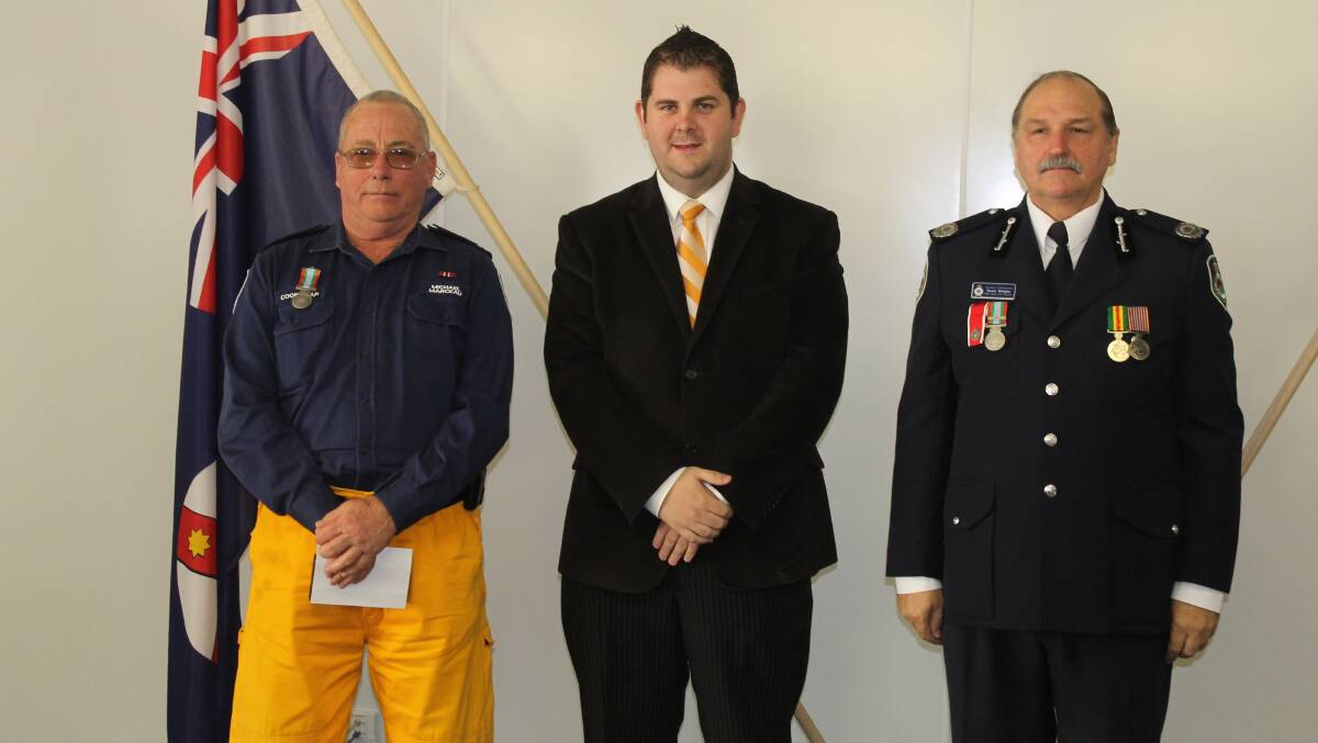 Michael Marceau of the Cooks Gap Brigade received the long service medal for 11 years service, he is pictured with Mid-Western Regional Council Deputy Mayor Cr Paul Cavalier and NSW RFS Assistant Commissioner Stuart Midgley.