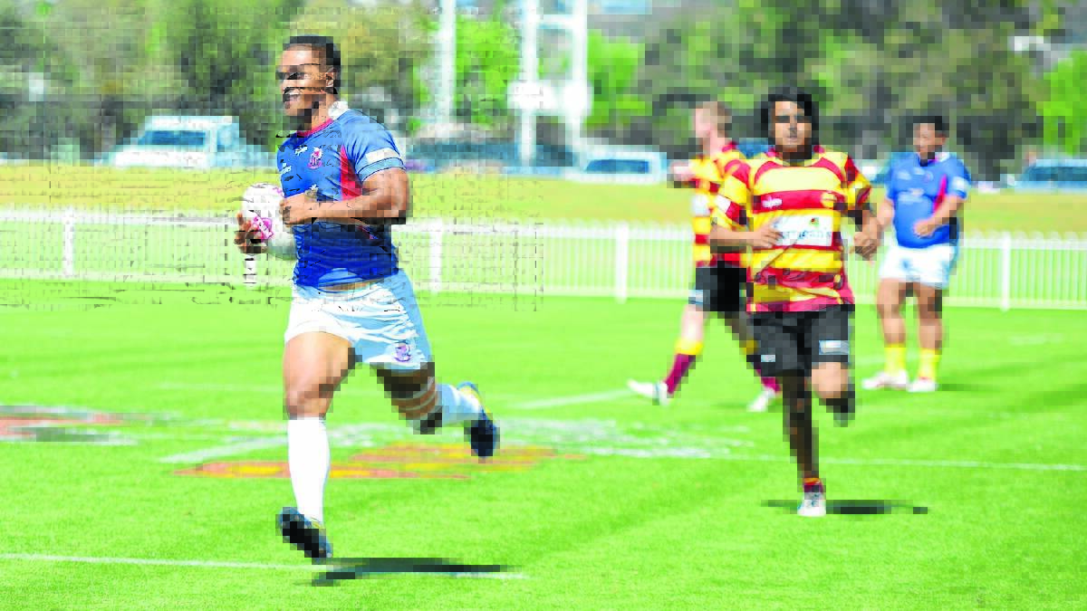 The PJL Constructions Mudgee Rugby Sevens tournament will be held at Glen Willow this Saturday. Pictured is Kotoni Ali heading off to score in the 2014 competition for Manly, one of the teams who will be making the trip again in 2015. PHOTO BY COL BOYD