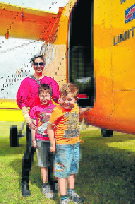 Samantha, Lachlan and Oliver Homes get ready to board an Antinov2 for a joy flight at the 2012 Wings, Wheels and Wines Airshow.