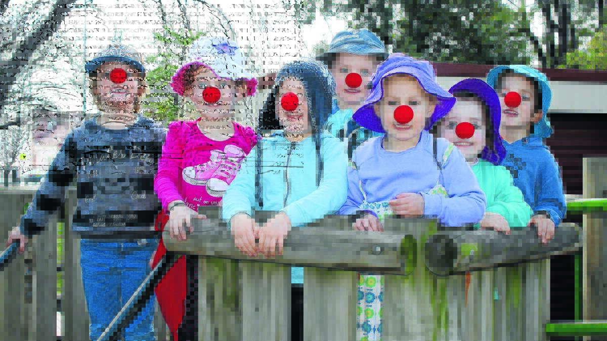 Levi O’Sullivan, Ava Walsh, Morgan Turner, Charlie Robertson, Holly Roberts, Natalie Howes and Oliver Roe celebrate Red Nose Day at Mudgee Pre School on Friday.