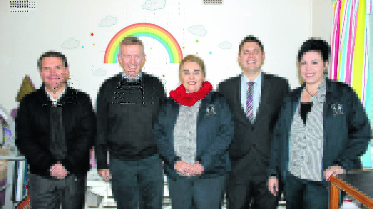 Board member Simon Byrnes, Federal Member for Parkes Mark Coulton, Mudgee Disability Support Service CEO Christine Puxty, board member Adam Woods and program officer Ingrid Puxty in the Rainbow Room at the service’s day programs facility.