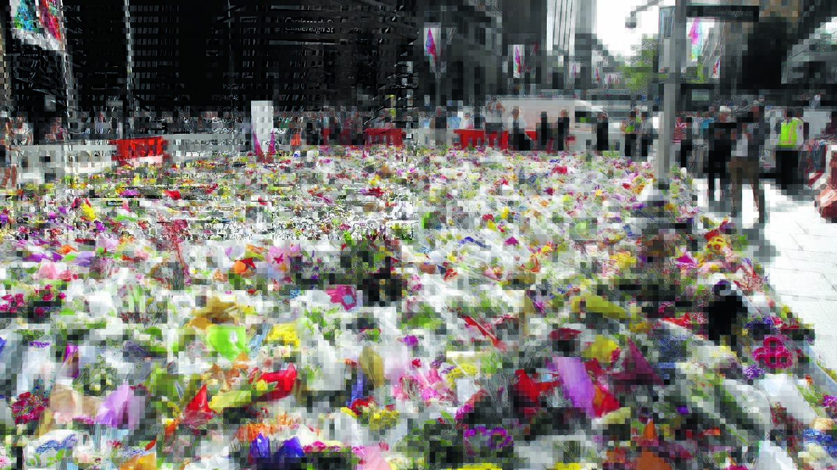 Floral tributes to the siege victims have filled Martin Place. PHOTO SUPPLIED