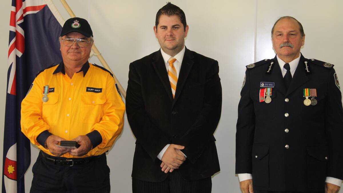 Clifford Wall of the Cooks Gap Brigade received the long service medal for 11 years service, he is pictured with Mid-Western Regional Council Deputy Mayor Cr Paul Cavalier and NSW RFS Assistant Commissioner Stuart Midgley.