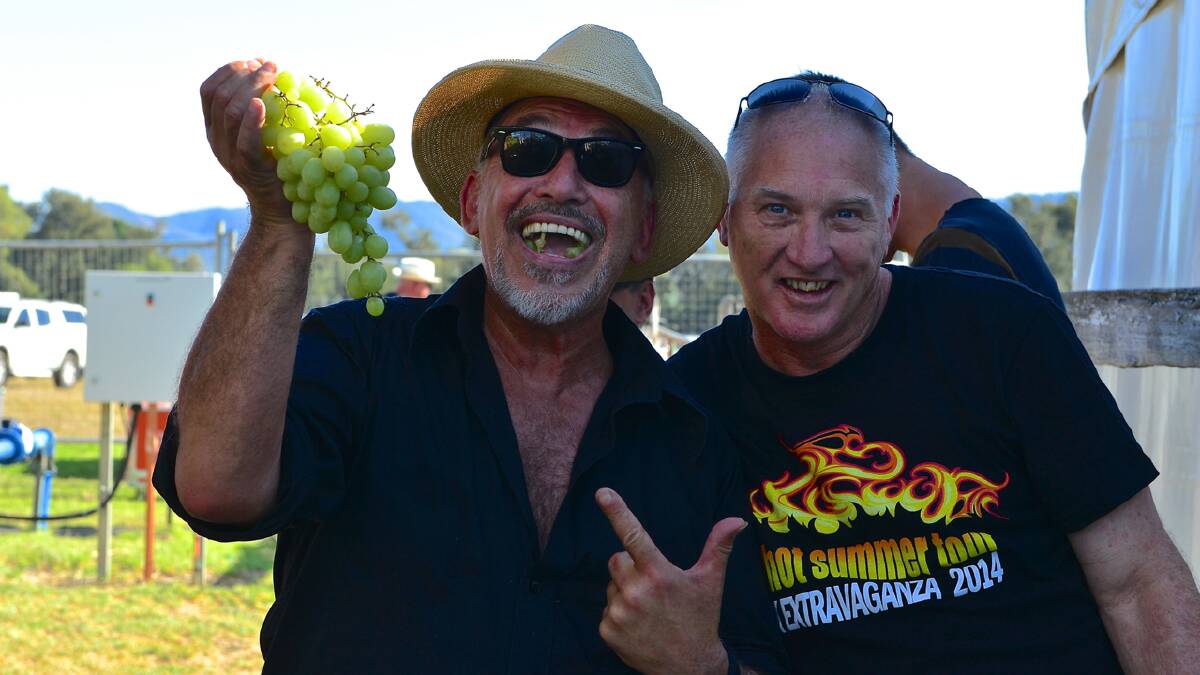Joe Camilleri and Red Hot Summer Tour MC Paul Taylor sample some Mudgee grapes.