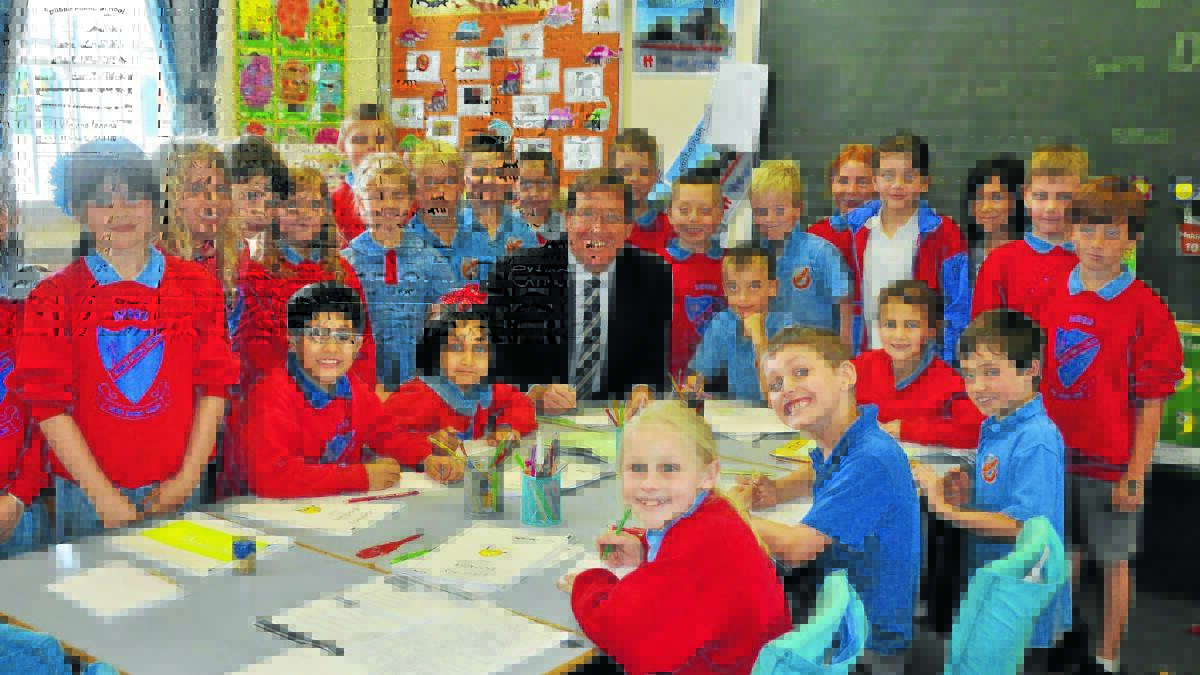 Public schools across the region will share in over $2 million in additional needs-based funding in 2015. Pictured is Member for Dubbo Electorate and Deputy Premier Troy Grant with students from Dubbo Public School.