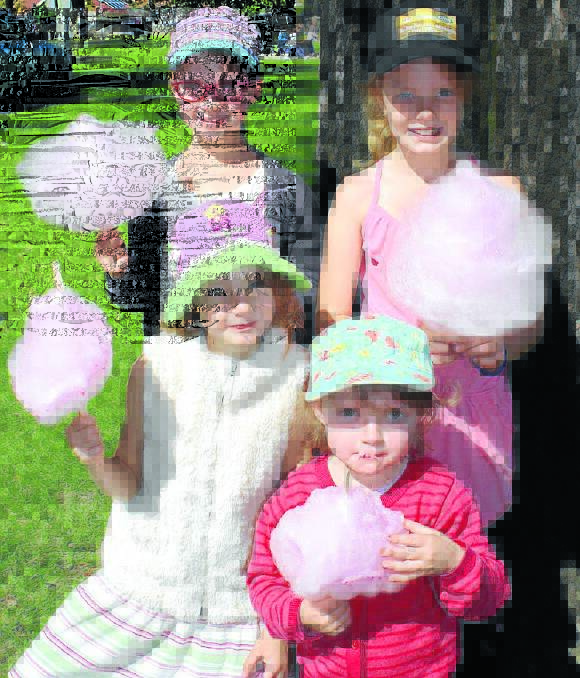Arqua Kyle, Isla and Ellie Scott-Stewart and Ruby-Jean Kyle tucked into fairy floss at the Lawson Park Markets.