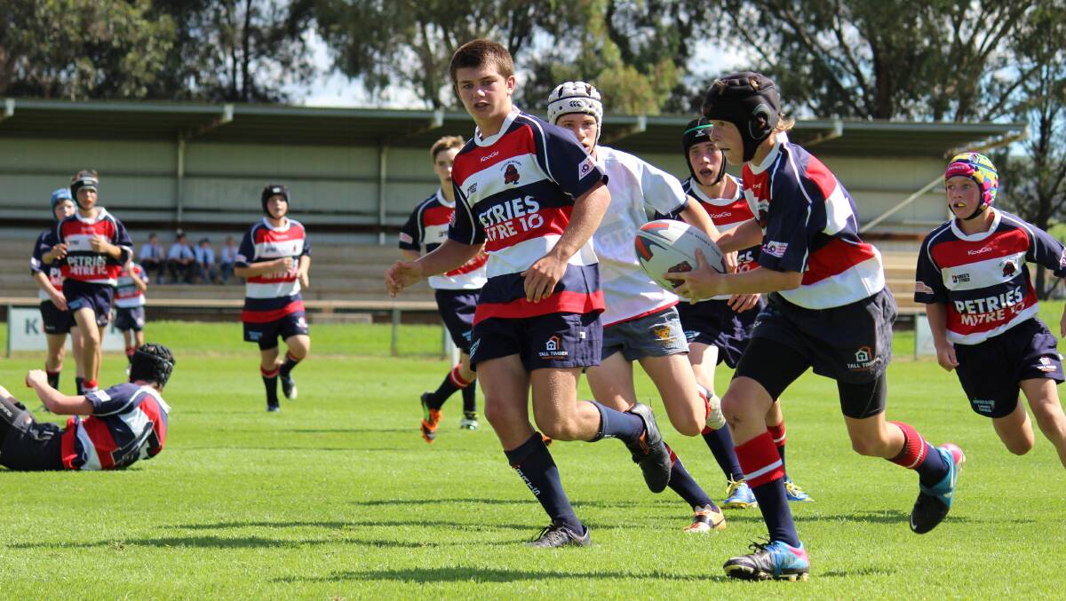 Mudgee Wombats under 15s Red player Tom Loughnan takes a run at Jubilee Oval on Saturday. PHOTO: DARREN SNYDER