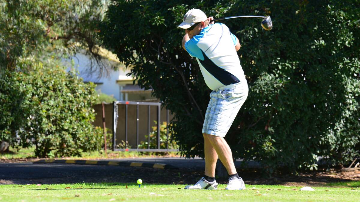 PERFECT SWING: Mudgee’s Matt Consadine tees off at the first hole before winning his fourth consecutive Easter Open on Saturday. PHOTO: COL BOYD