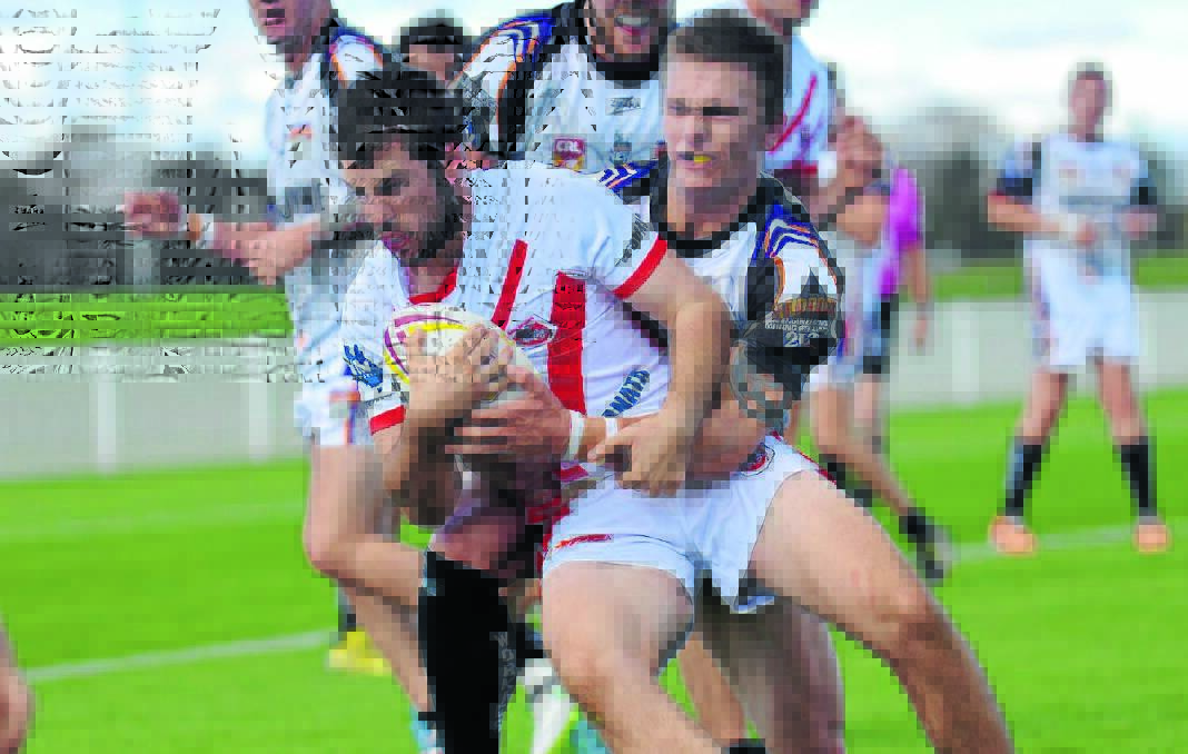 Mudgee fullback Cameron Maynard carts the ball forward against the Workies defence in what was a tough game for the home side at Glen Willow Stadium. Photo: Col Boyd 