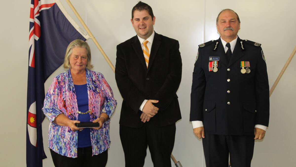 Carol Wall of the Cooks Gap Brigade received the long service medal for 11 years service, she is pictured with Mid-Western Regional Council Deputy Mayor Cr Paul Cavalier and NSW RFS Assistant Commissioner Stuart Midgley.