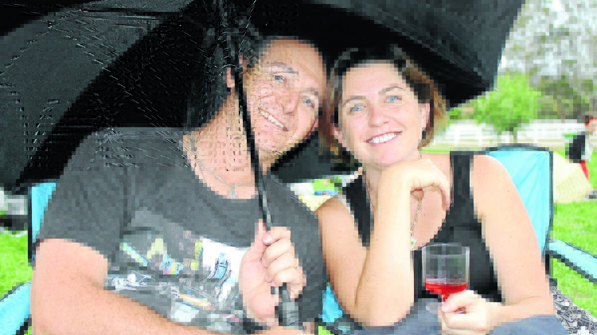 Jo and Sheldon Gates of Mudgee under their umbrella.