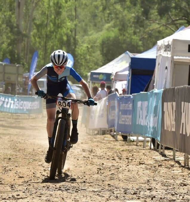 TWO-WHEEL HERO: Lachlan Burke races for the finish line in the Oceania titles in Toowoomba.