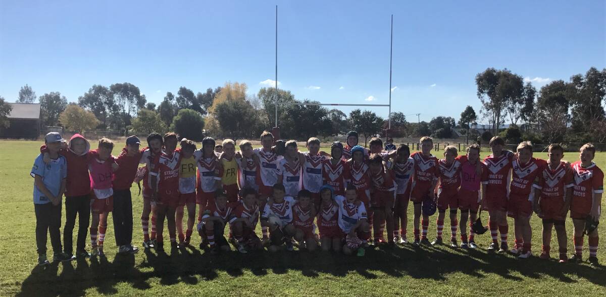 RED AND WHITE: The young Dragons put on a show for the spectators in their grand final rematch. Photo: supplied.