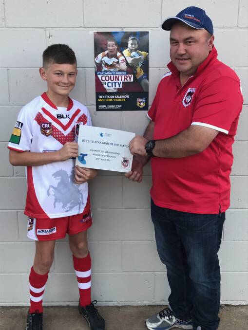 Broden Konz with Mudgee Junior Rugby League President Robbie Clayton presenting the award.