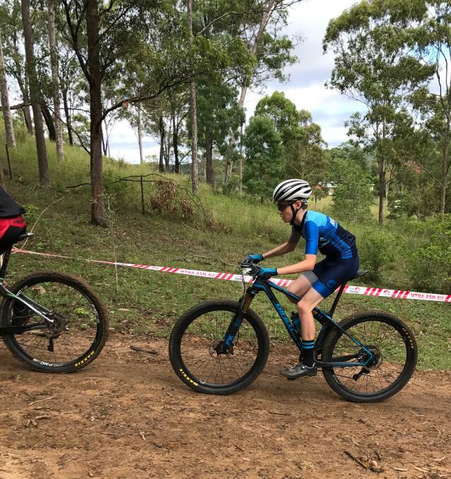 UPHILL BATTLE: Lachlan Burke races in the difficult and dangerous track at Canungra on the Gold Coast. Photo: supplied.