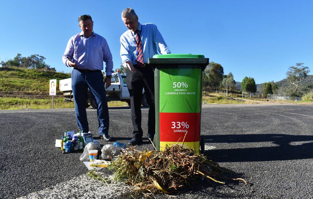 Mid-Western Regional Council Mayor Des Kennedy and General Manager Brad Cam with a breakdown of materials found in the current household waste bin.