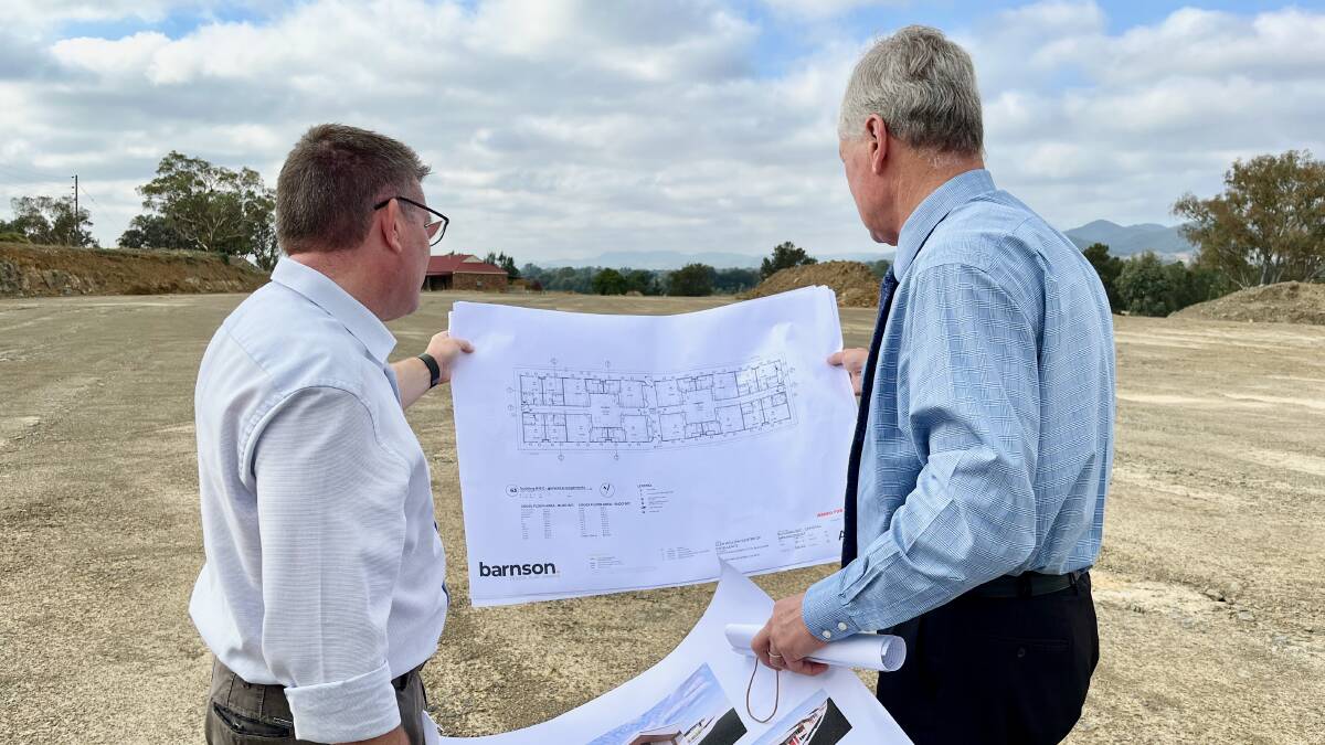 MP Dugald Saunders looks over printed plans for the facility with Council GM Brad Cam in 2023. Photo: Benjamin Palmer