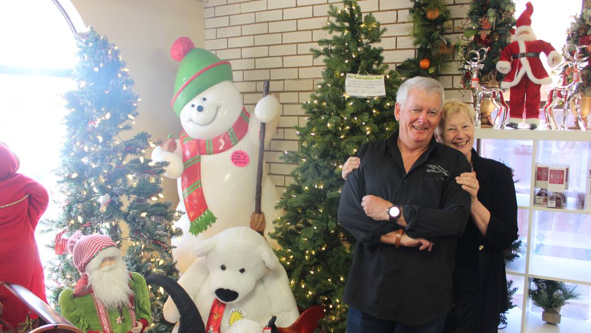 SANTA'S LITTLE HELPERS: James and Liz Watters are the owners of The Mudgee Christmas. Photo: Jake Humphreys